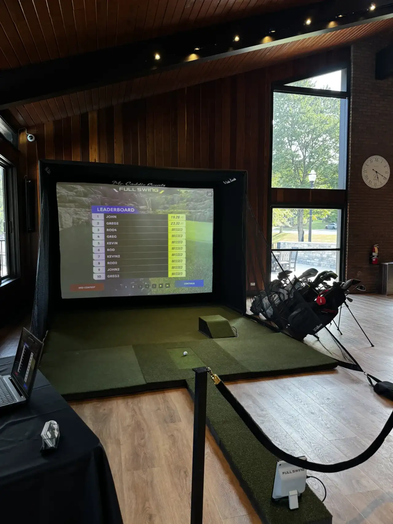 Mr. Caddie Events portable golf simulator rental van parked at night